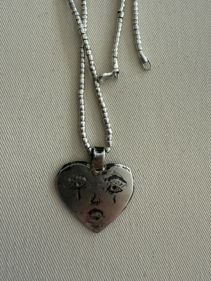 Placa corazón triste de plata